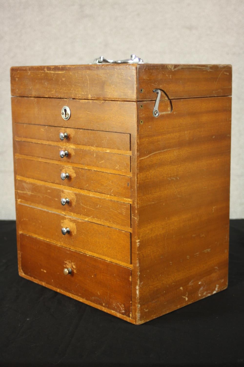 A mid 20th century teak collector's cabinet, with a foldover lid above six graduated fitted - Image 4 of 9