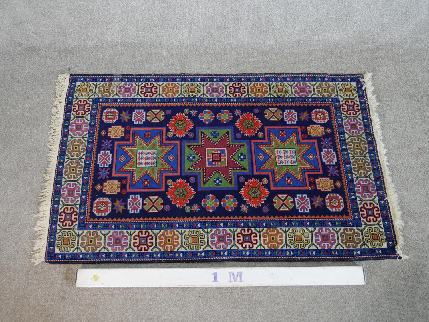 A blue ground hand made Russian Kazak rug. W.129 D.80cm - Image 2 of 6