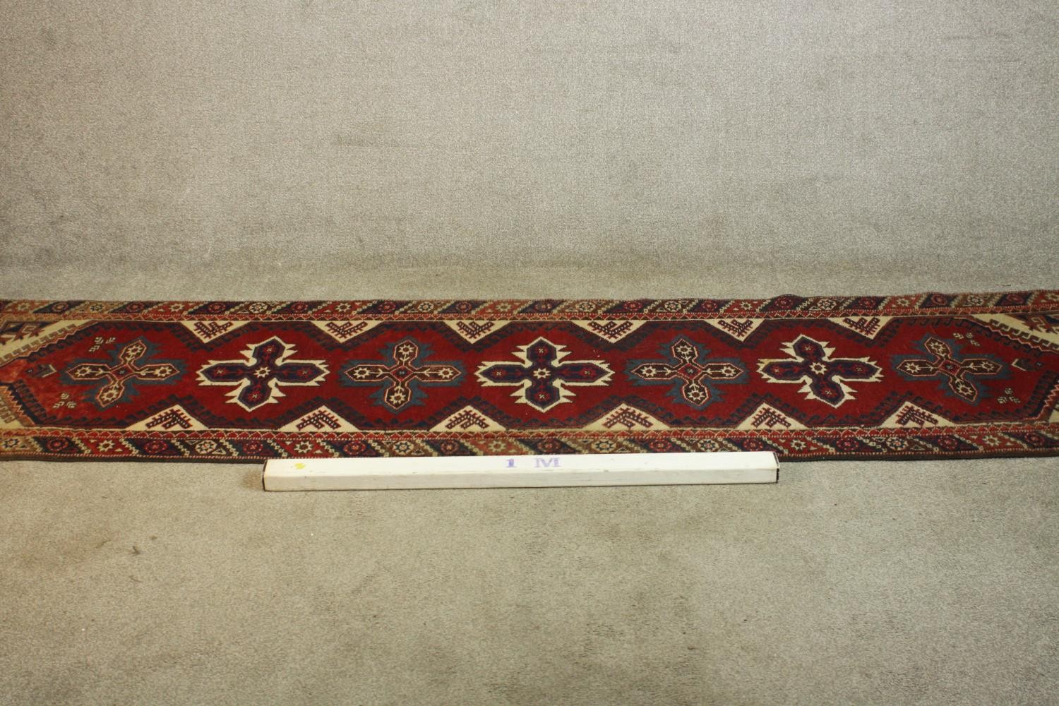 A hand made red ground Turkish Dosemealti runner. L.280 W.77cm - Image 2 of 5