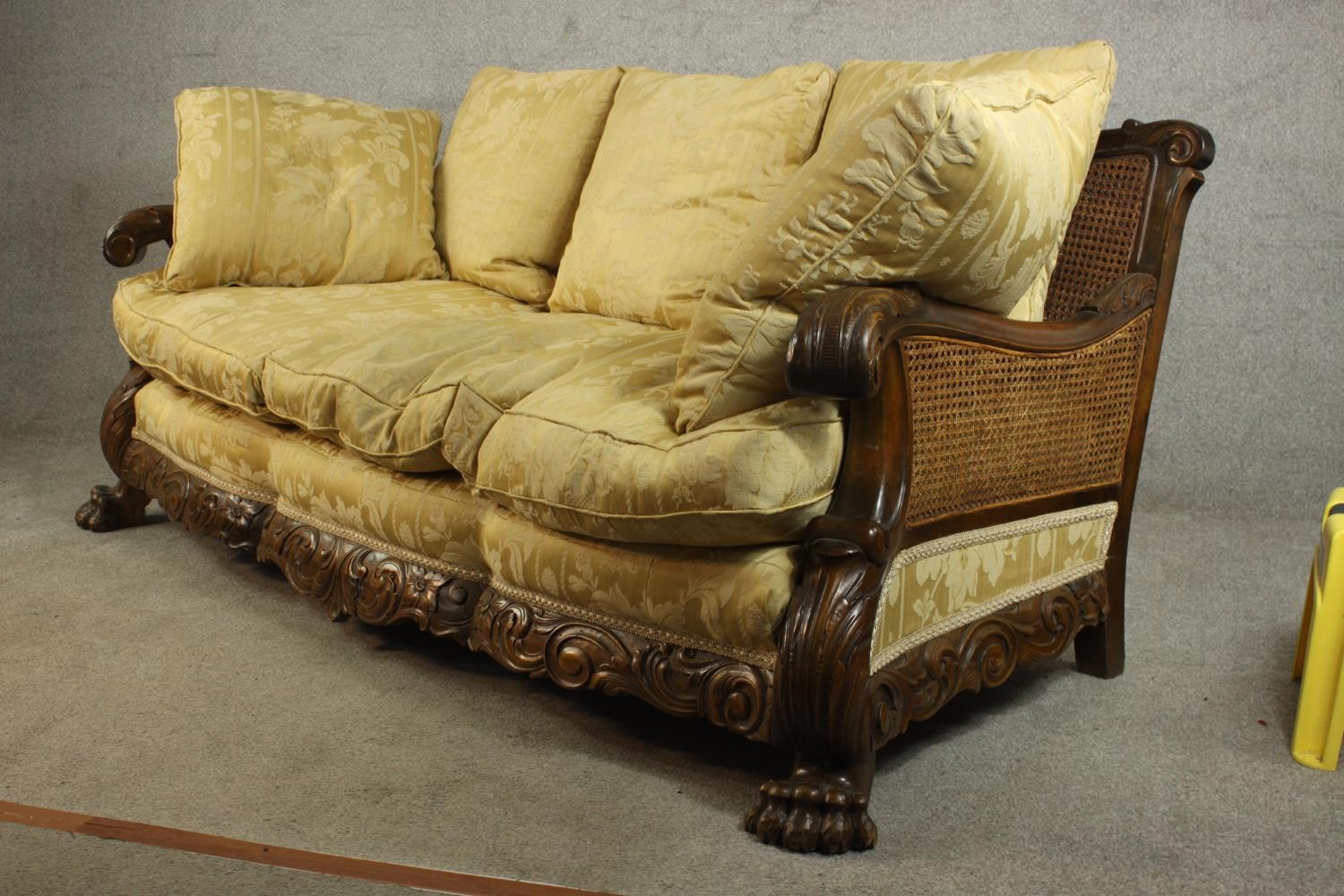 An early 20th century Continental carved walnut three seater bergere sofa, upholstered in gold - Image 3 of 18