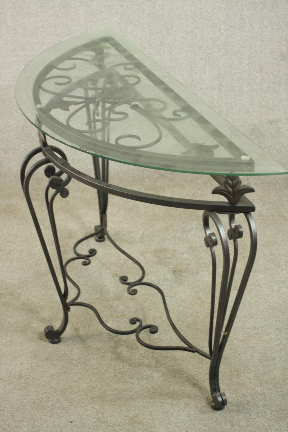 A contemporary wrought iron side table, of demi lune form with a plate glass top on three - Image 7 of 9