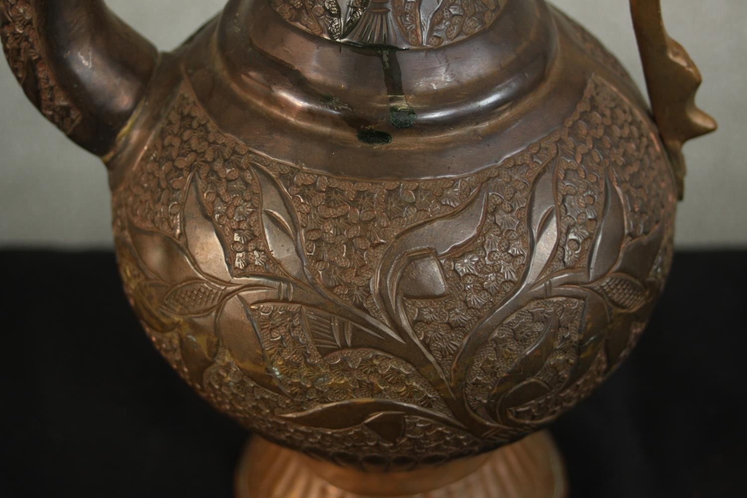 A Turkish engraved copper ewer decorated with a foliate design. H.37 W.24 D.13cm. - Image 5 of 12