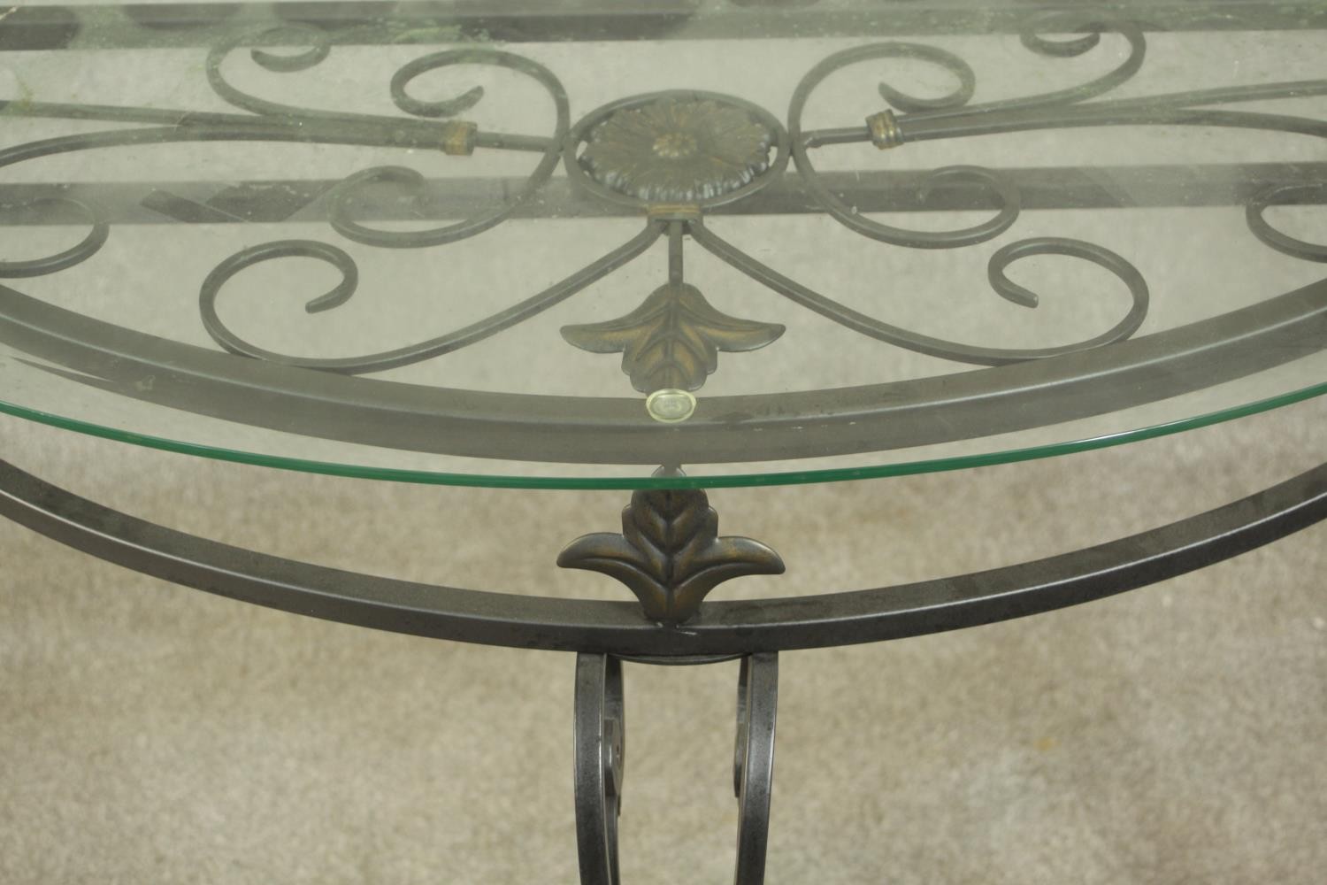 A contemporary wrought iron side table, of demi lune form with a plate glass top on three - Image 3 of 9