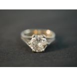 A red leather boxed 14 carat white gold diamond solitaire ring with an approximate carat weight of