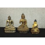 Three 20th century brass and bronze Indian Buddhas, one with gilded detailing. H.11 W.7 D.5cm. (