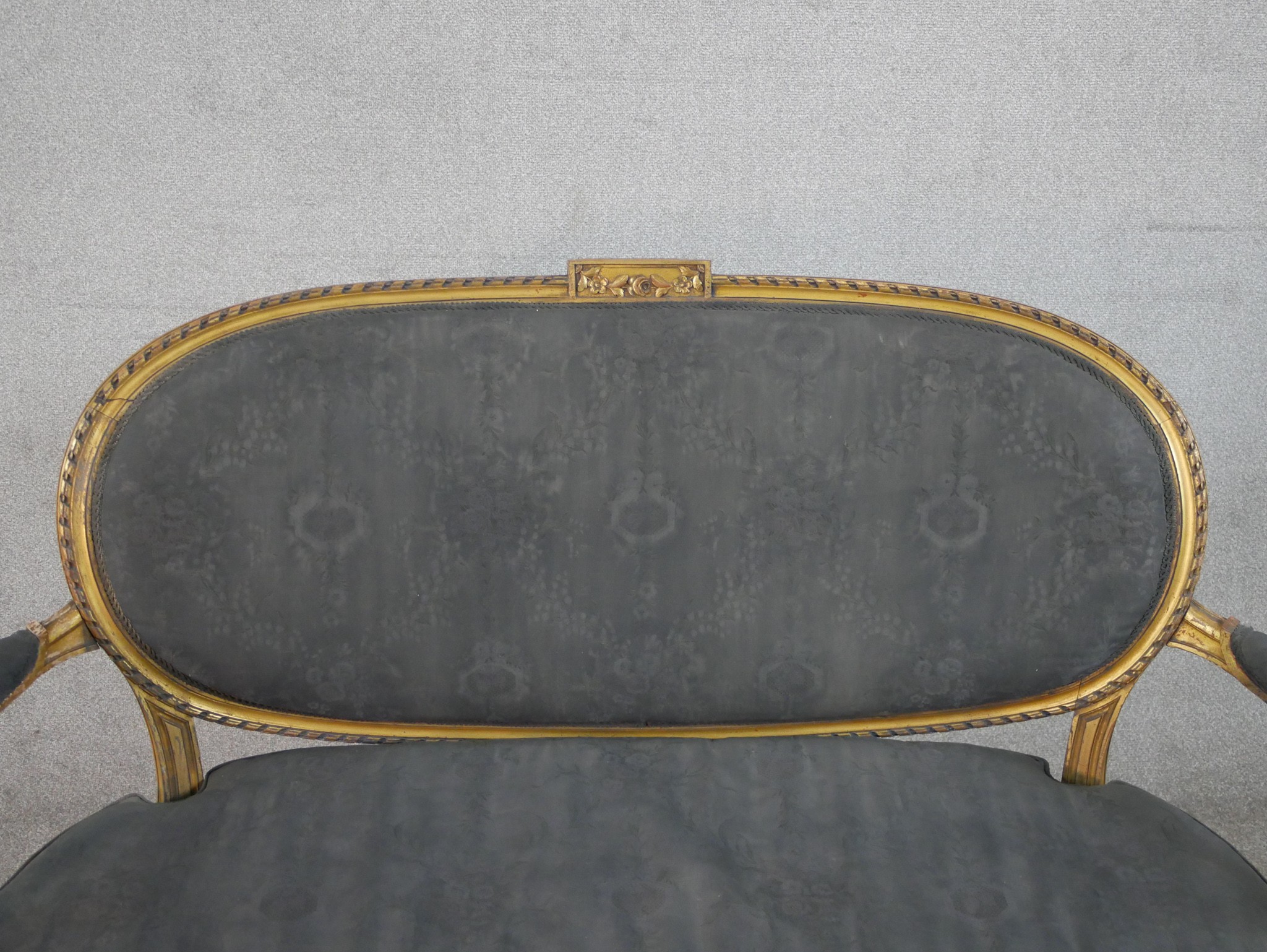 A French Louis XVI style carved giltwood canape, upholstered in grey fabric to the oval back, the - Image 3 of 6