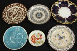 A collection of six ceramic plates, including a lustre ware platter with bird and foliate design,