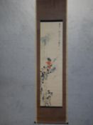 A Japanese scroll with floral and bamboo design and character inscription with red artist's seal.