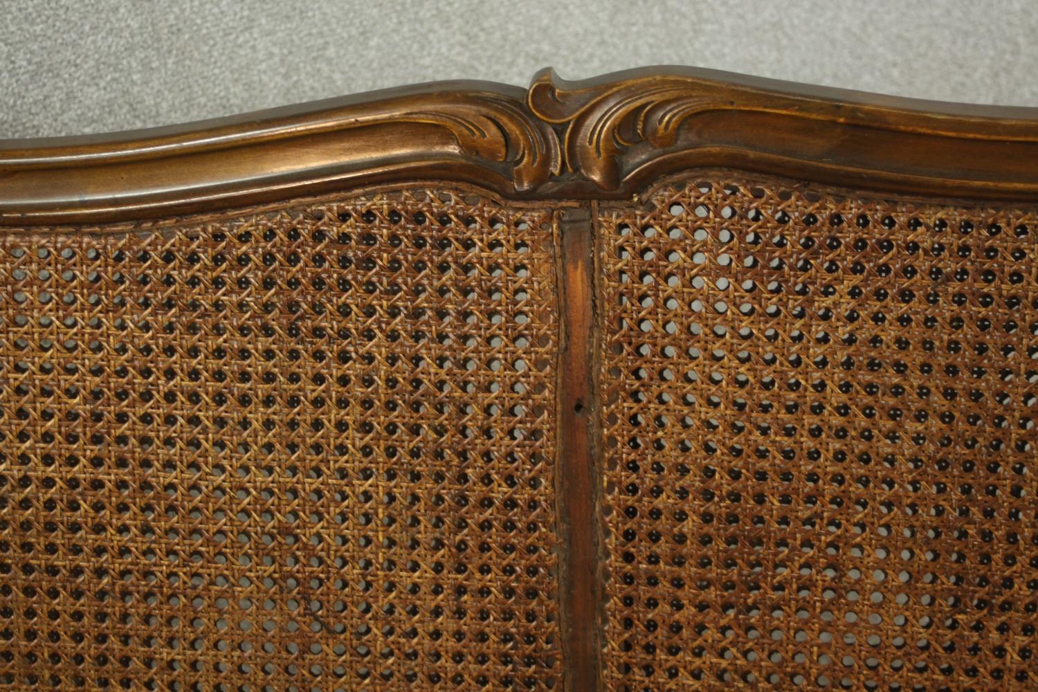 An early 20th century Continental carved walnut three seater bergere sofa, upholstered in gold - Image 13 of 18