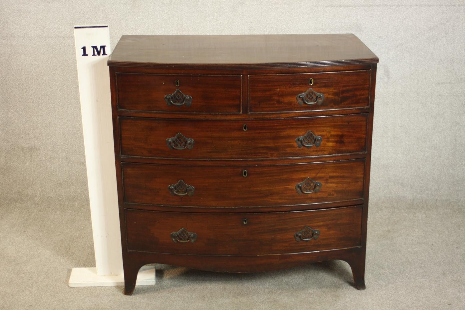 A George III bowfronted mahogany chest of two short over three long drawers above a shaped apron and - Image 2 of 8