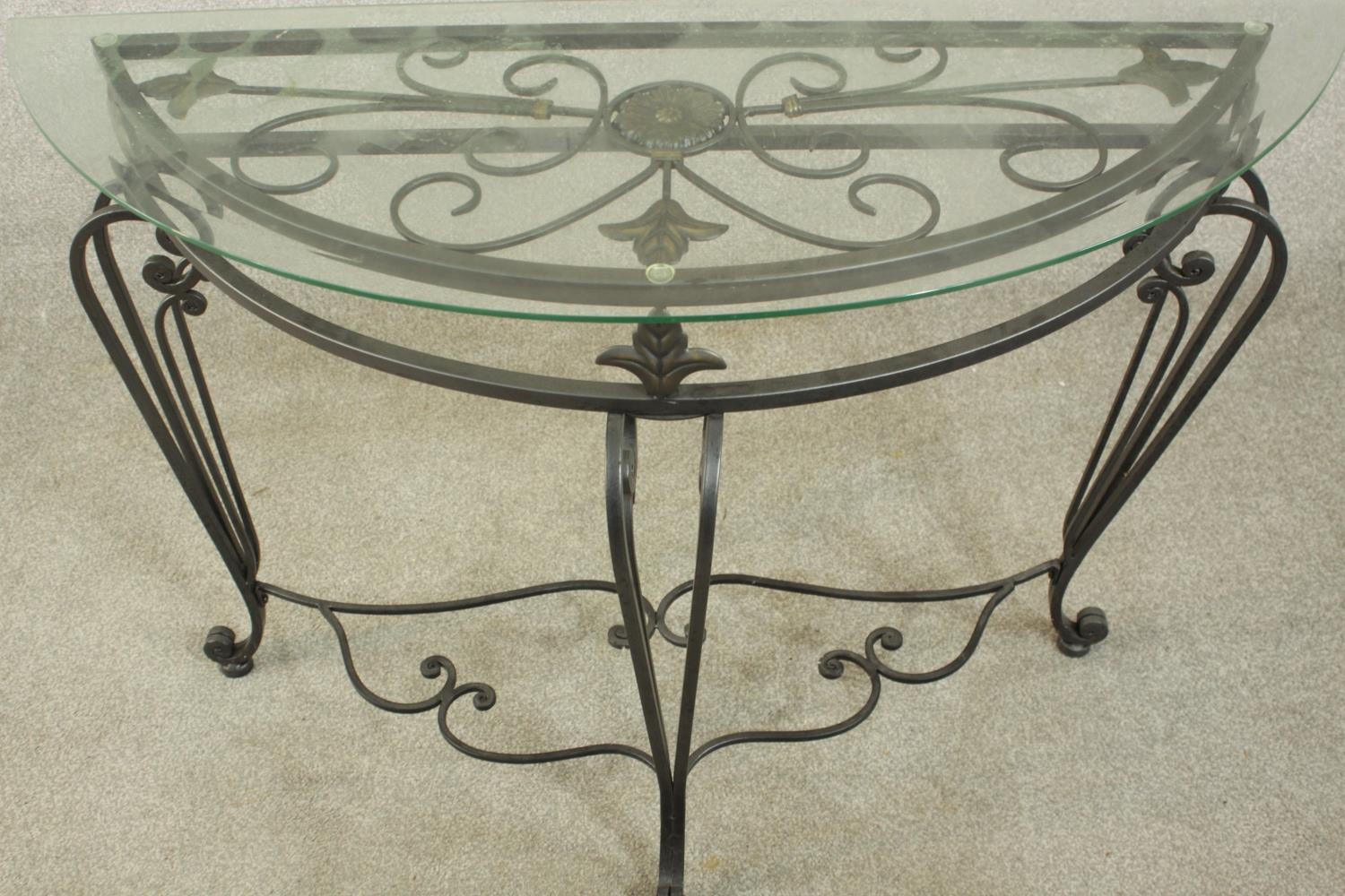 A contemporary wrought iron side table, of demi lune form with a plate glass top on three - Image 6 of 9