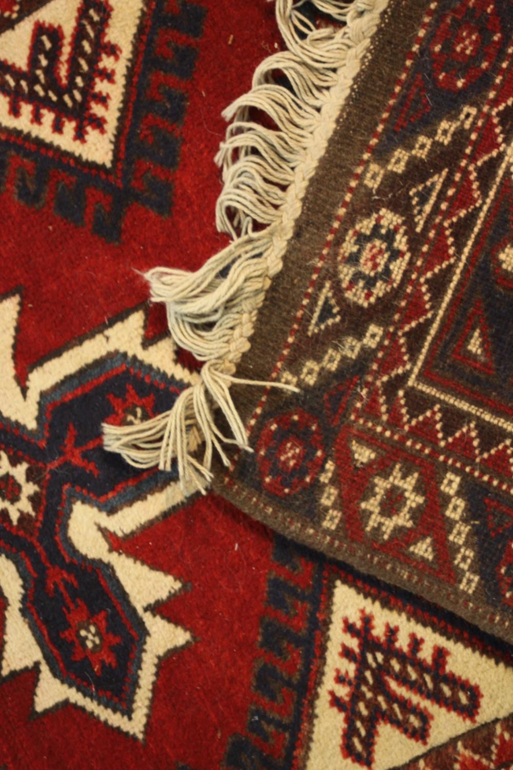 A hand made red ground Turkish Dosemealti runner. L.280 W.77cm - Image 5 of 5