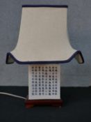 Chinese porcelain lamp decorated with Chinese caligraphy raised on hardwood base H.42 W.31 D.23cm