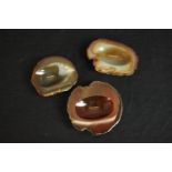 Three carved and polished banded agate slice ashtrays. H.2 L.12cm. (largest)