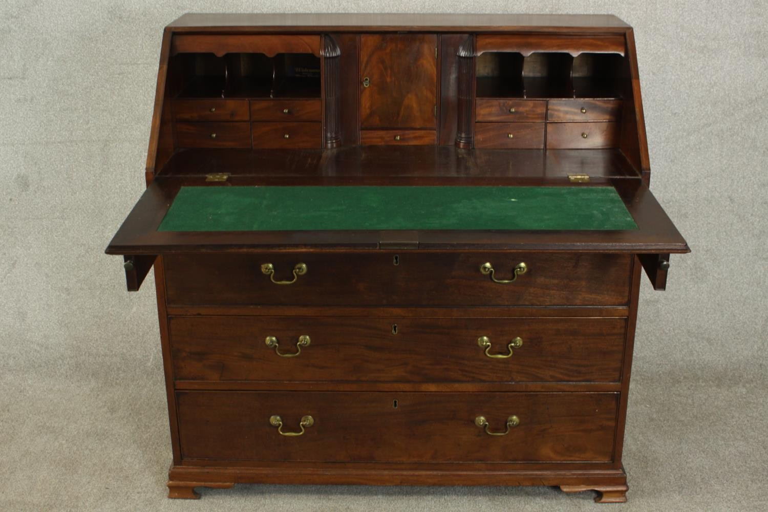 A 19th century mahogany bureau, the fall front enclosing a green writing surface with an arrangement - Image 3 of 12