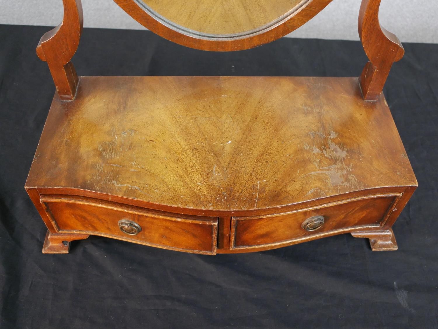 A George III style mahogany toilet mirror, with a shield shaped mirror, the serpentine base with two - Image 2 of 7