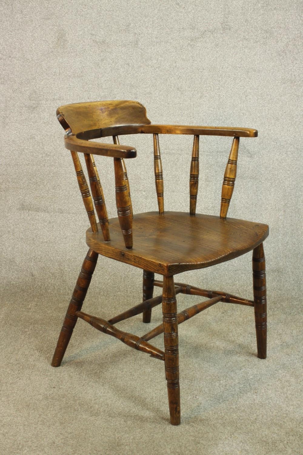 A 19th century captain's tub chair, the back on ring turned spindles, over an elm seat, on ring - Image 3 of 5