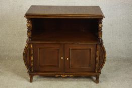 A late 20th century side cabinet, the rectangular top with a moulded edge supported by turned and