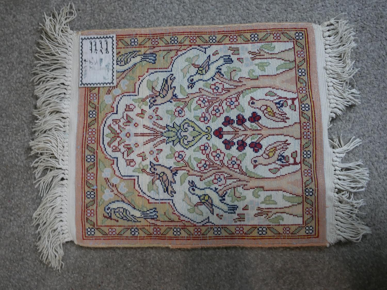 A cream ground hand made Persian silk Kum rug. W.33 D.28cm - Image 4 of 5