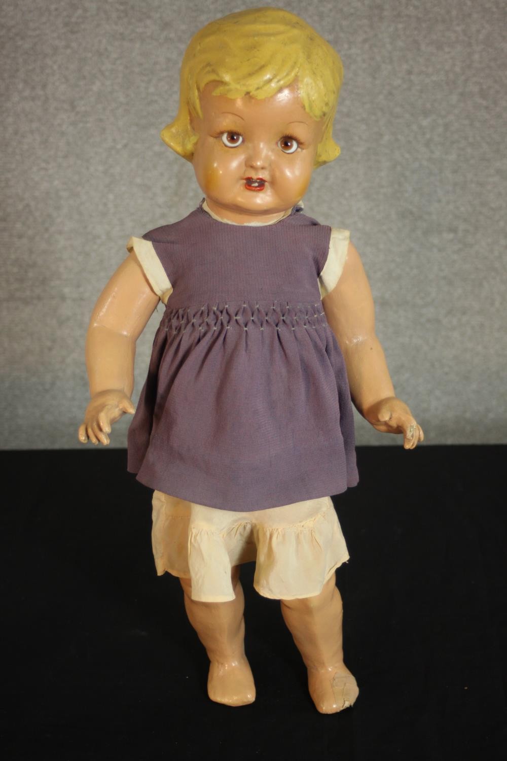A late 19th century-early 20th century painted papier mache doll with glass eyes and voice box. (not - Image 4 of 9