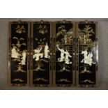 A set of four contemporary Chinese black lacquered panels, decorated with figures made from mother