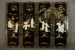 A set of four contemporary Chinese black lacquered panels, decorated with figures made from mother