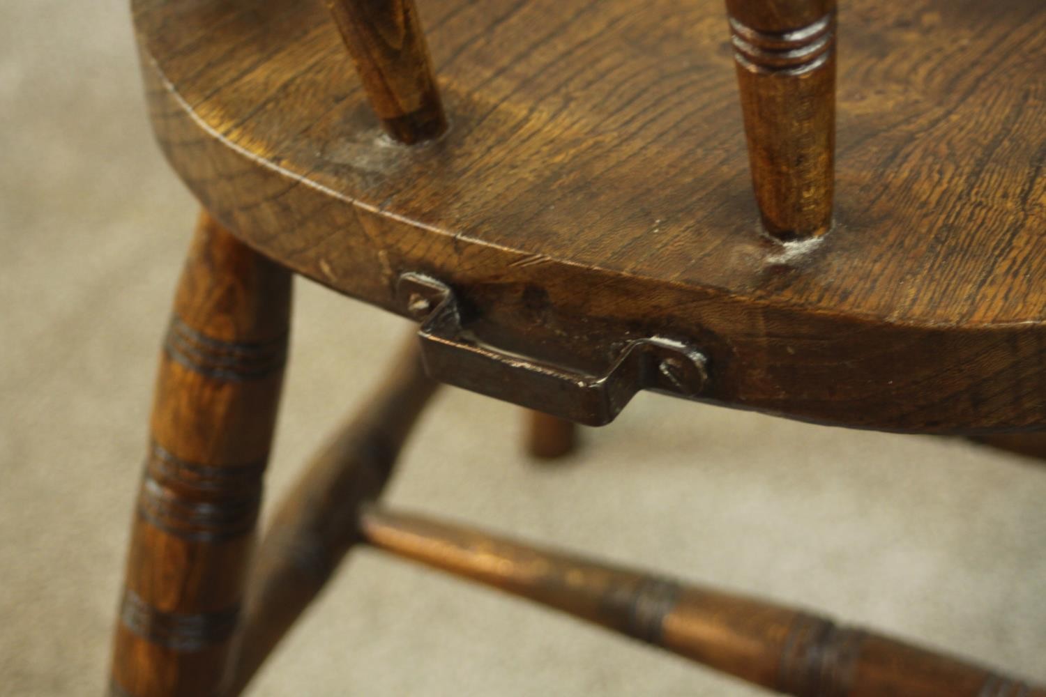 A 19th century captain's tub chair, the back on ring turned spindles, over an elm seat, on ring - Image 4 of 5