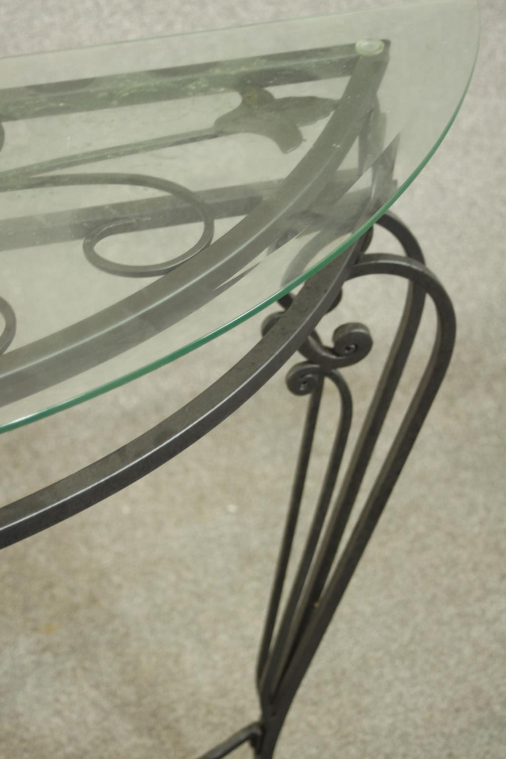 A contemporary wrought iron side table, of demi lune form with a plate glass top on three - Image 4 of 9