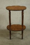 A 20th century Italian or French marquetry inlaid side table, the top and undertier of shell form,
