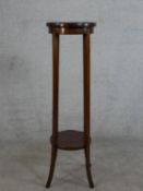 An Edwardian mahogany two tier circular jardinere stand H.99 Diam.29cm