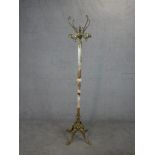A circa 1970's brass and onyx hat and coat rack, on four cabriole legs terminating in paw feet. H.