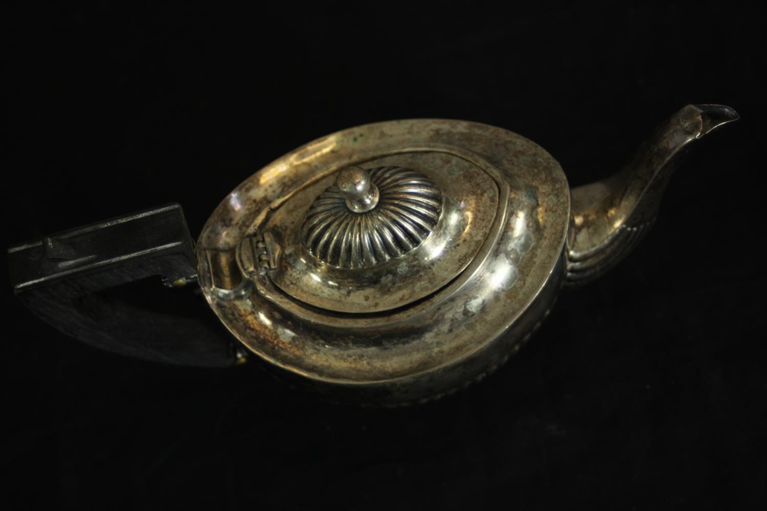 An Austrian gadrooned silver tea pot with ebony handle. Hallmarked: Austrian assay marks, maker's - Image 2 of 4