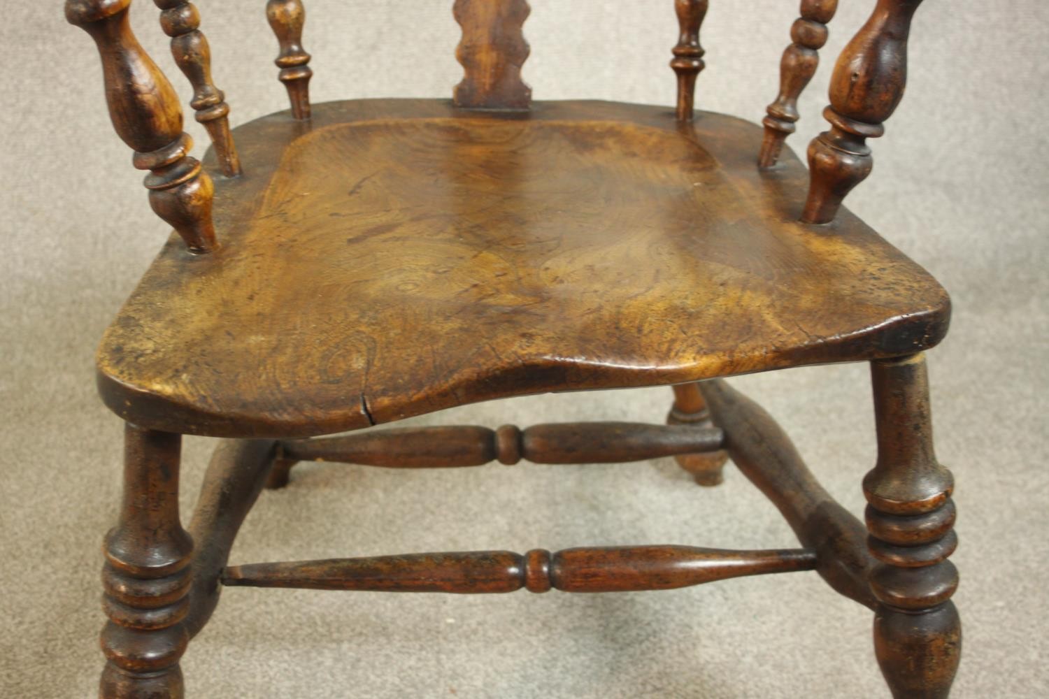 A 19th century Windsor armchair, with a yew hoop back and pierced splat over an elm seat, on - Image 4 of 7