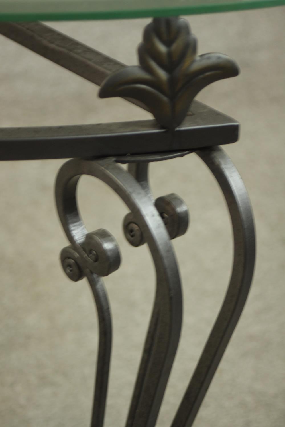 A contemporary wrought iron side table, of demi lune form with a plate glass top on three - Image 9 of 9