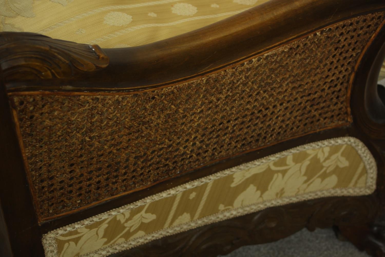 An early 20th century Continental carved walnut three seater bergere sofa, upholstered in gold - Image 17 of 18