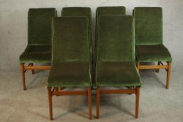 A set of six circa 1960s teak dining chairs, upholstered in green velour on tapering legs joined