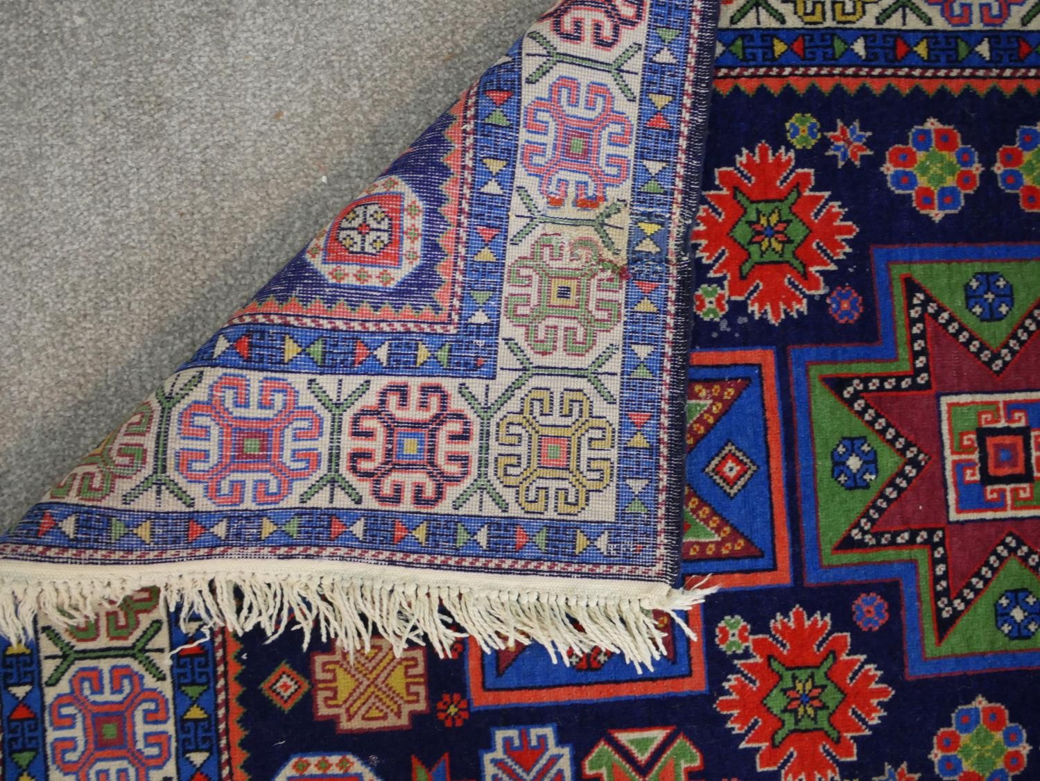 A blue ground hand made Russian Kazak rug. W.129 D.80cm - Image 6 of 6