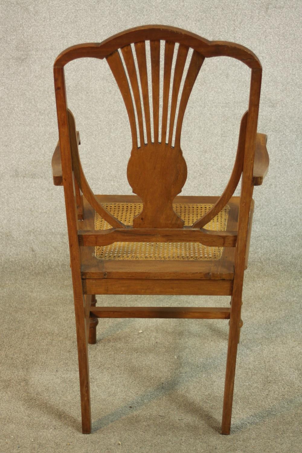 An early 20th century walnut and marquetry inlaid armchair, with a pierced splat back over a caned - Image 5 of 8