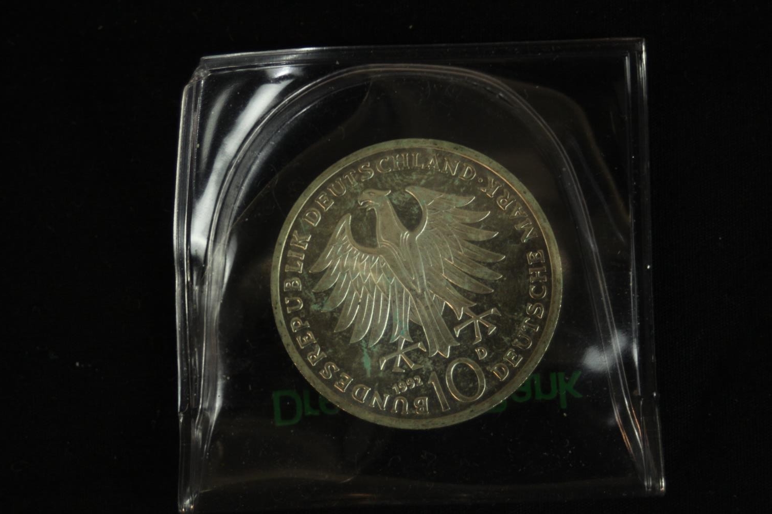 A cased 100 Escudos Papal visit silver proof coin along with a silver German coin and silver medal - Image 7 of 9