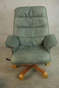 A late 20th century Scandinavian Stressles style grey/blue leather chair with footstool, the chair