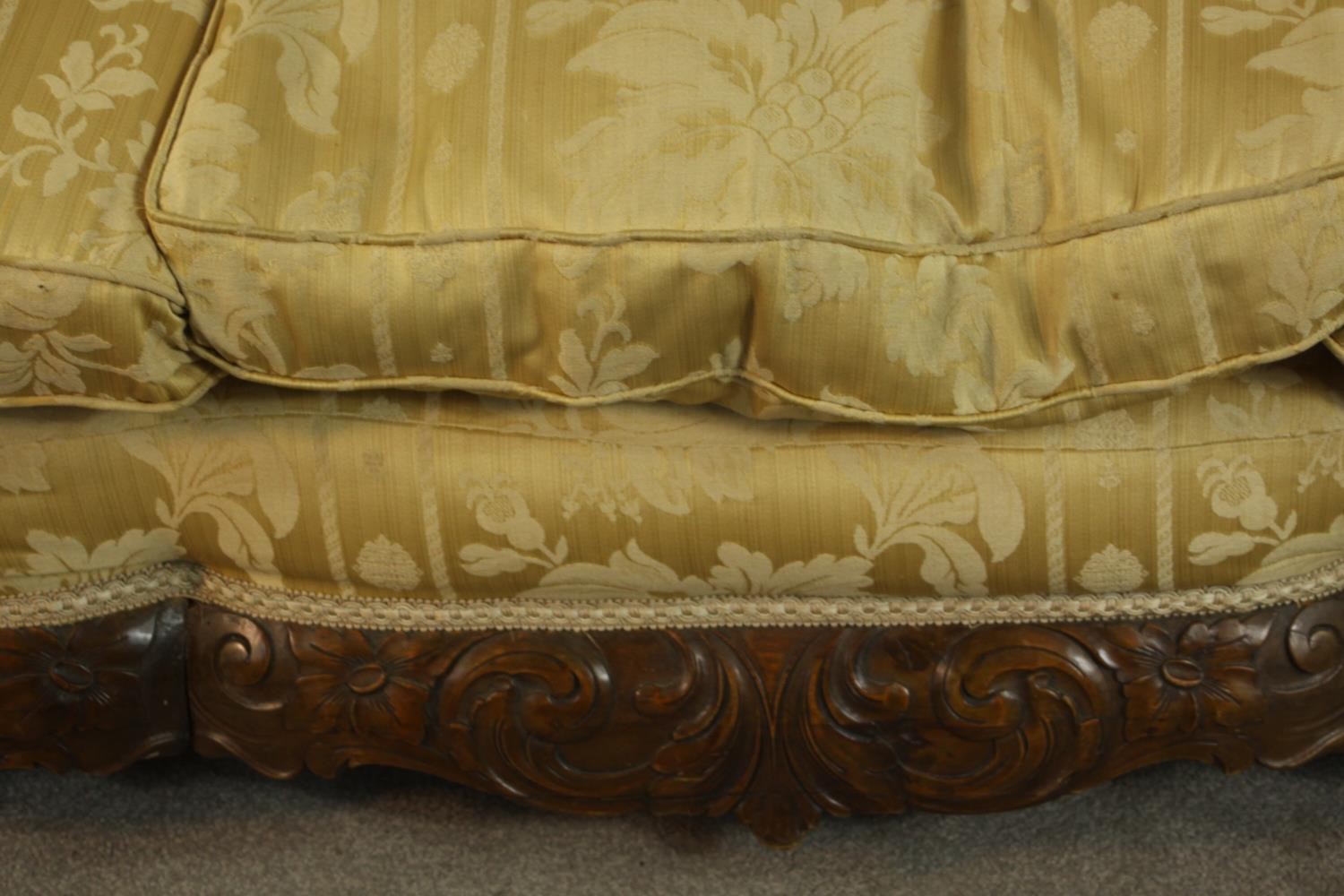 An early 20th century Continental carved walnut three seater bergere sofa, upholstered in gold - Image 7 of 18