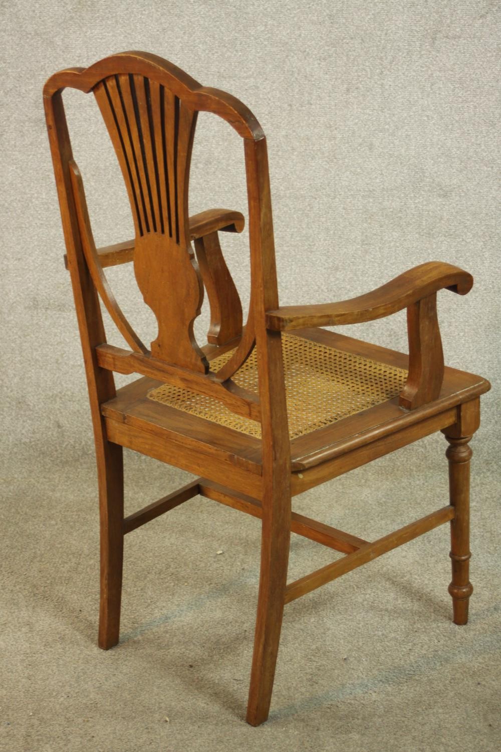 An early 20th century walnut and marquetry inlaid armchair, with a pierced splat back over a caned - Image 4 of 8