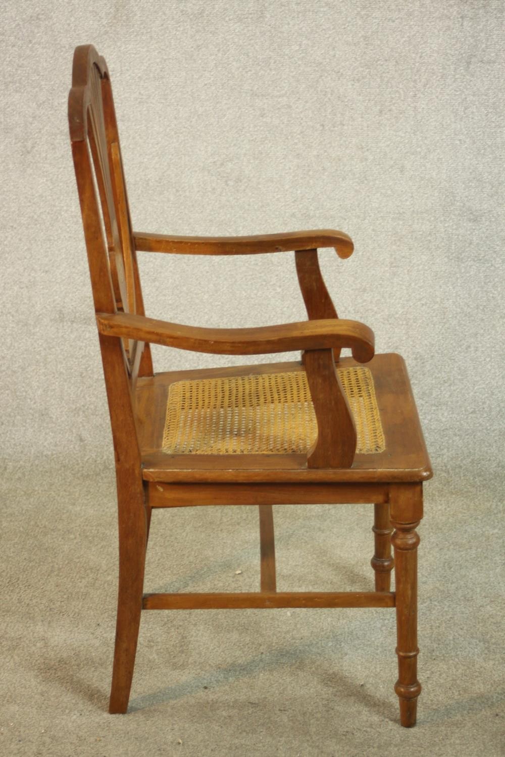 An early 20th century walnut and marquetry inlaid armchair, with a pierced splat back over a caned - Image 3 of 8