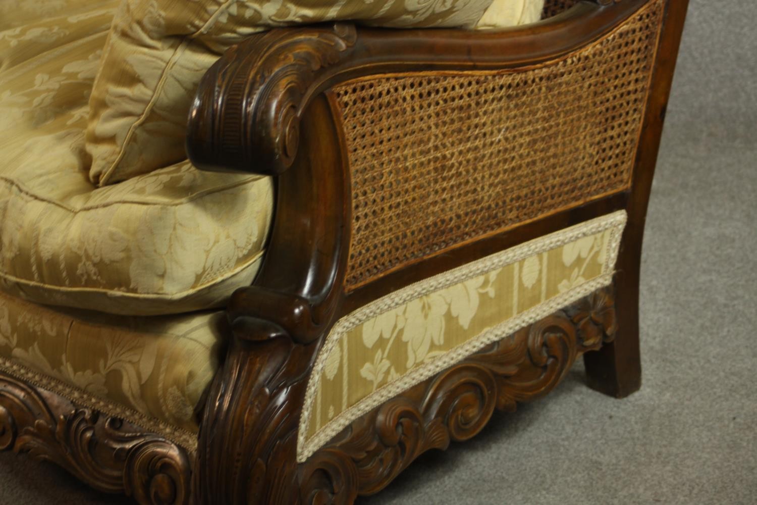 An early 20th century Continental carved walnut three seater bergere sofa, upholstered in gold - Image 10 of 18