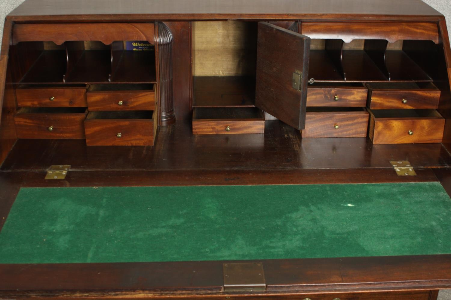 A 19th century mahogany bureau, the fall front enclosing a green writing surface with an arrangement - Image 5 of 12