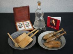 Two 19th century pewter dishes, along with two treen darning tools, a butter pat, a Pukeberg, Sweden