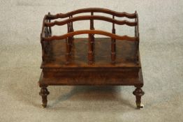 A Victorian figured walnut Canterbury, with lyre ends, the dividers with turned supports, on