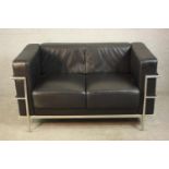 After Le Corbusier, an LC2 two seater sofa, with black leather upholstery and a chromed tubular