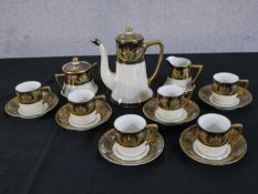 A Japanese Noritake gilded relief fruit design porcelain coffee set, comprising a coffee pot, milk