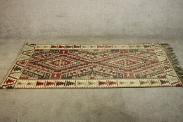 A hand made Turkish Kelim rug. H.193 W.107cm.